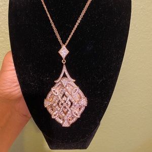C N rose gold tone necklace and ring